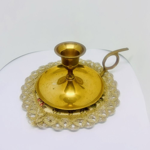 Vintage brass candlestick with handle and drip plate, used