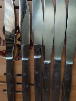 Set of six inox knives like new with handle design