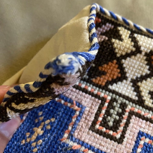 Embroidered pillow used with minor wear