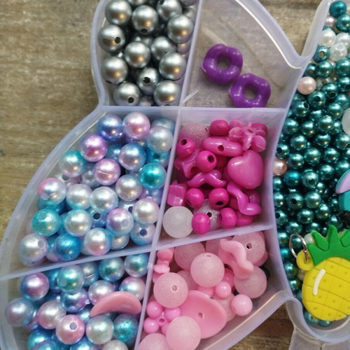 Colored beads used with thread, incomplete set