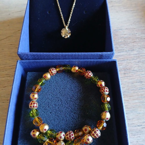 Swarovski necklace and bracelet set like new, gold color