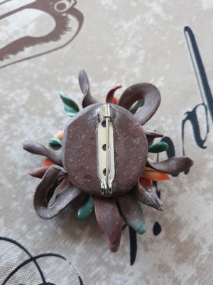 Handmade pin used, polymer clay