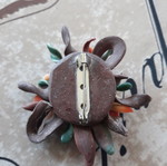Handmade pin used, polymer clay