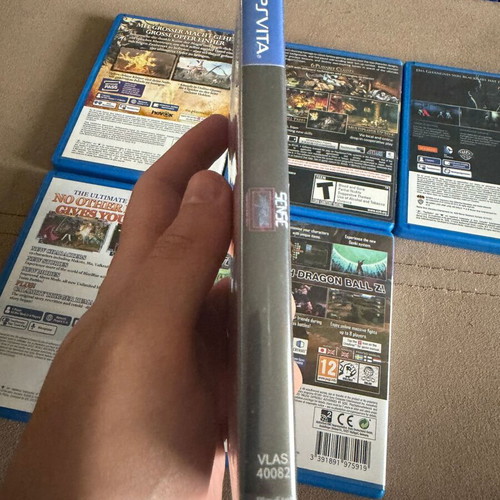 PS Vita game set of 6 like new, including Blazblue, DBZ, Soul Sacrifice