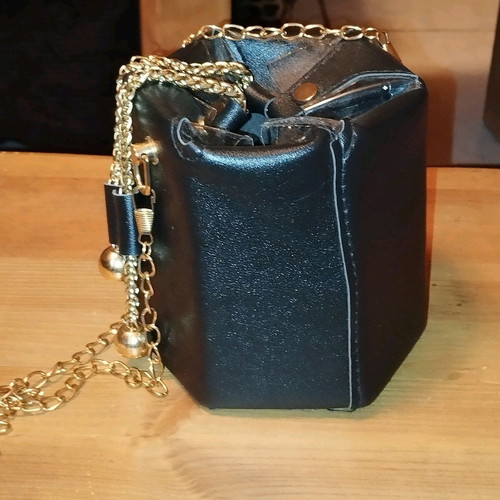 Modern pouch bag like new, black and gold