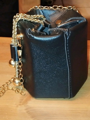 Modern pouch bag like new, black and gold