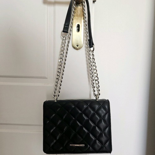 Quilted bag with metal strap like new, black