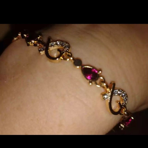Bracelet with rubies and crystals new, gold and pink