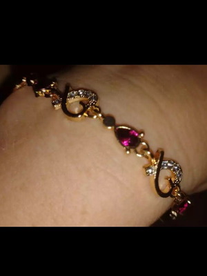 Bracelet with rubies and crystals new, gold and pink