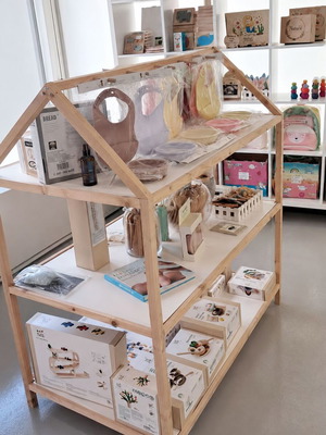 Wooden house-shaped display shelf for store