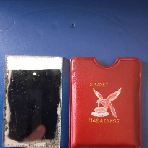 Two-sided mirror used with Papagalos coffee logo