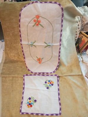 Set of two used hand-embroidered doilies