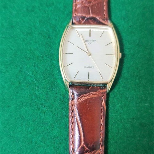 Orient VX wristwatch like new, gold color, leather strap