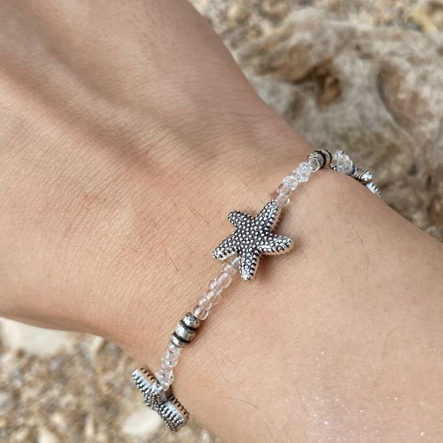 Bracelet with starfish and transparent beads, silver color