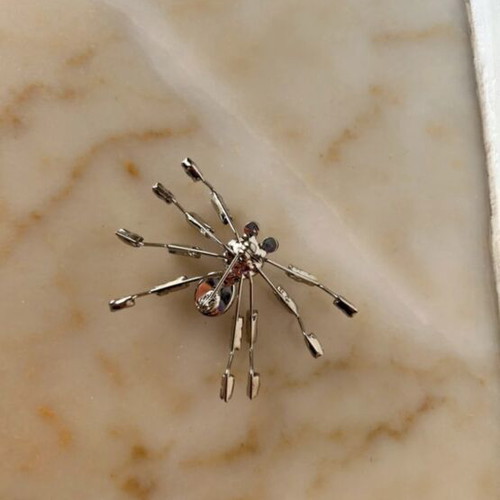 Spider brooch like new with rhinestones and gold crystals