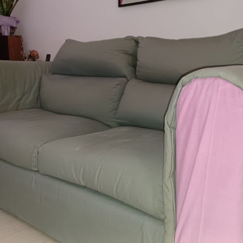 Two-seater sofa used, gray with purple-pink fabric on arms