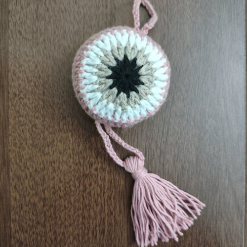 Handmade knitted eye for stroller or cradle, rose color, diameter 8.5 cm