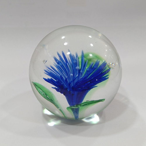 Vintage handmade art glass paperweight with blue flower