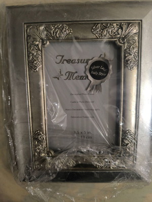 Silver photo frame with embossed design like new