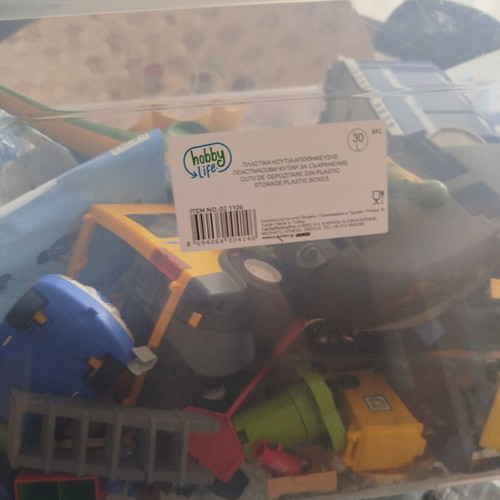 Playmobil box with helicopter, dragon, school bus, garbage truck and more