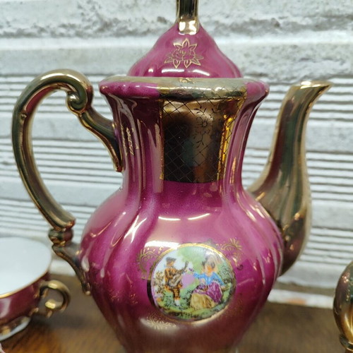 Porcelain coffee set used, 15 pieces, burgundy-fuchsia with gold details