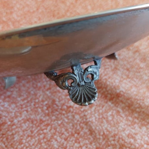 Silver-plated centerpiece bowl used with carved details and three feet