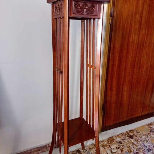 Handcrafted tall wooden plant stand with carved floral details