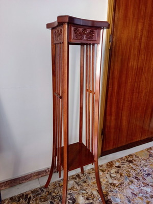 Handcrafted tall wooden plant stand with carved floral details