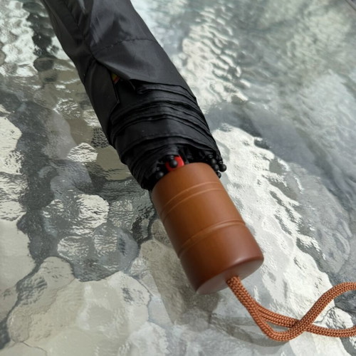 Folding umbrella new, black with colorful print and brown handle