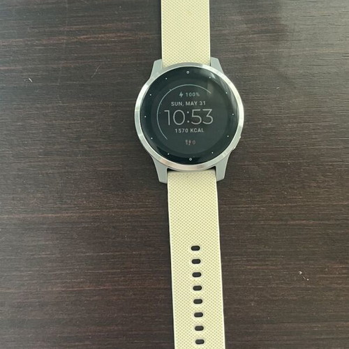 Garmin Vivoactive 4s smartwatch with charger and two straps