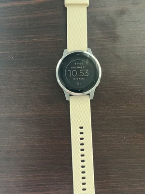 Garmin Vivoactive 4s smartwatch with charger and two straps