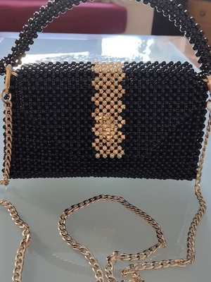 Handmade shoulder bag with black pearls and gold details