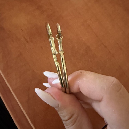 Gold color faux earrings used, slightly faded