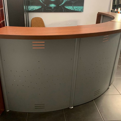 Reception desk used with metal perforated front panel