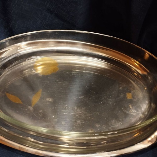 Heat-resistant serving dish used with base and lid
