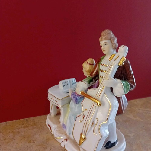 Porcelain vintage figurine with couple playing musical instruments new