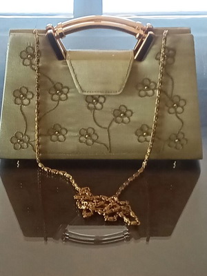 Small gold handbag with handle and long chain, like new