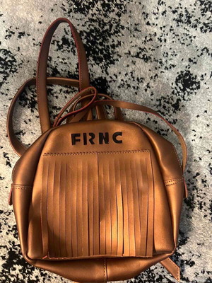 FRNC backpack like new, gold color