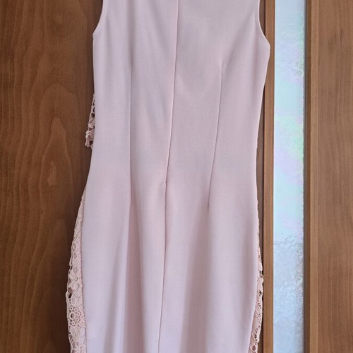 Lace dress in salmon peach shade with floral pattern and waist detail