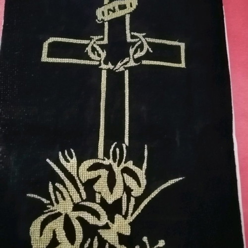 Handmade embroidered cross with gold thread on black velvet canvas
