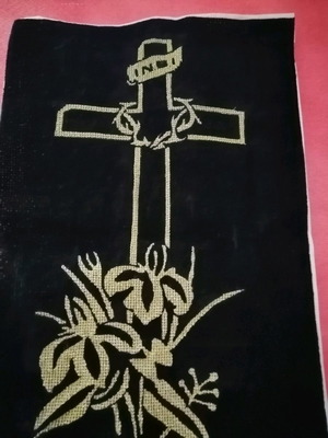 Handmade embroidered cross with gold thread on black velvet canvas