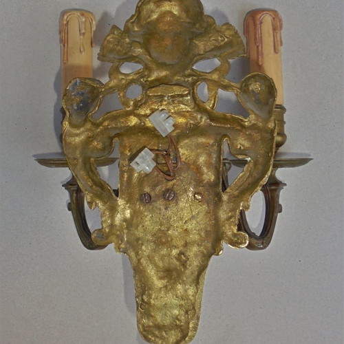 Pair of bronze antique two-light wall sconces, late 19th century