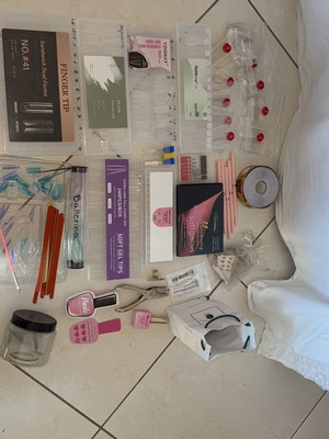 Nail products set like new with dual forms, tips, and accessories