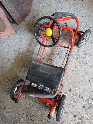 Vintage metal pedal go-kart from the 1980s