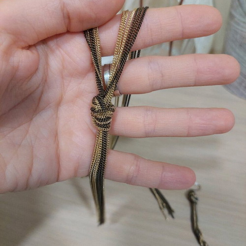 Jewelry set like new with knot and khaki gold chains