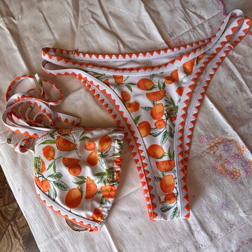 Women's swimsuit like new, white and orange with orange print, size M