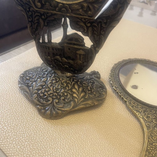 Set of two brass mirrors, table and hand used