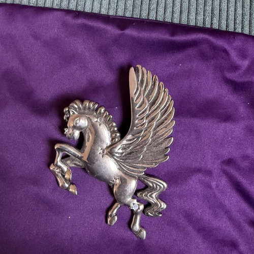 Pegasus brooch like new, silver color