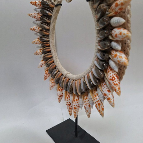 Decorative shell necklace like new on custom stand
