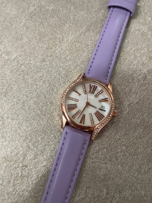 Women's watch like new with purple strap and rose gold dial